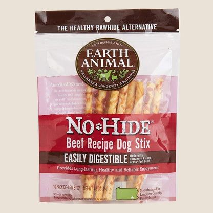 Package of Earth Animal No-Hide Beef Recipe Dog Stix on a beige background